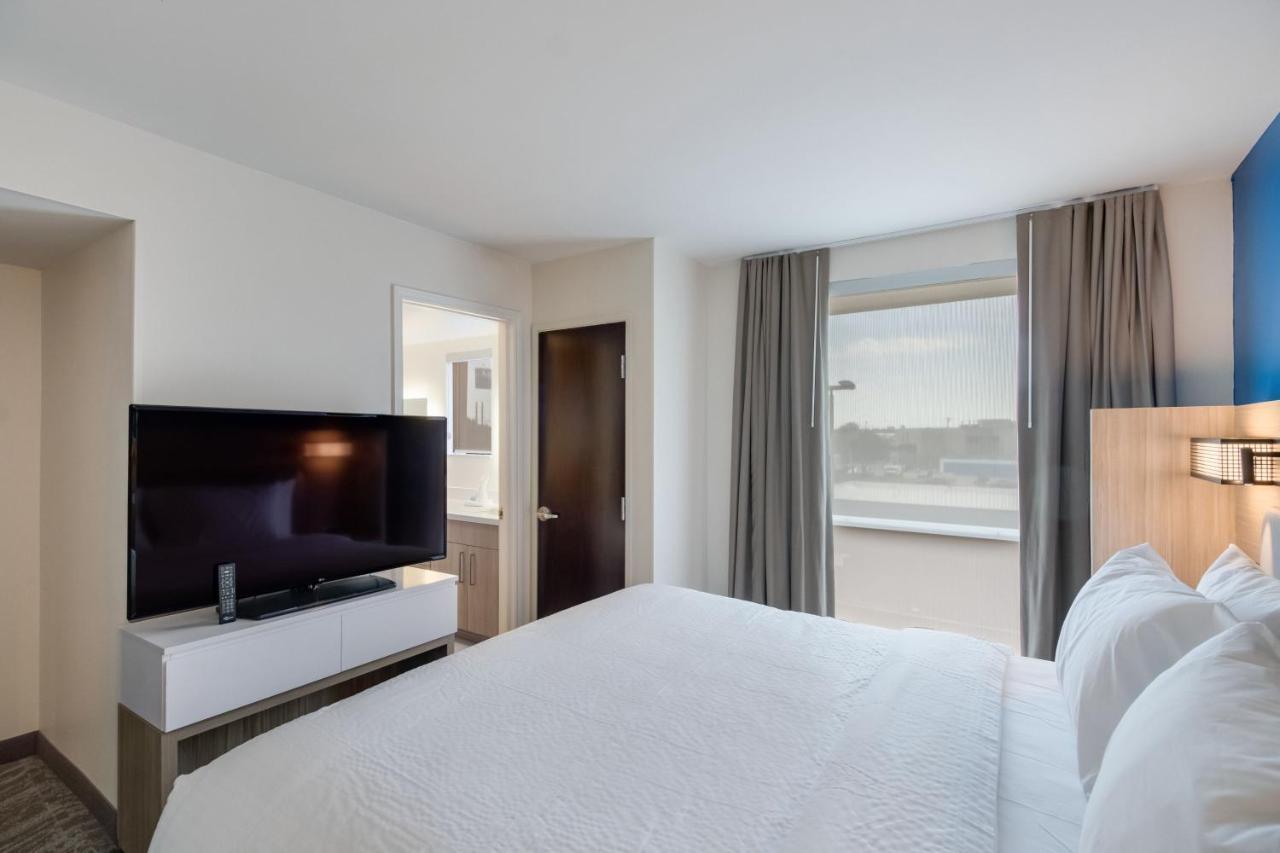 Two-Bedroom Suite with One King Bed, Two Queen Beds, Full Kitchen and Trundle Sofa