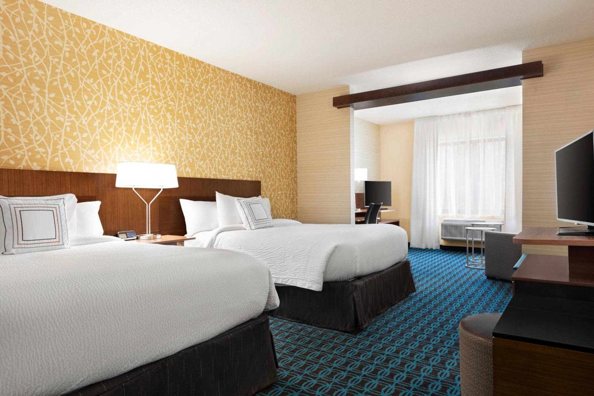 Deluxe Queen Suite with Two Queen Beds and Sofa Bed